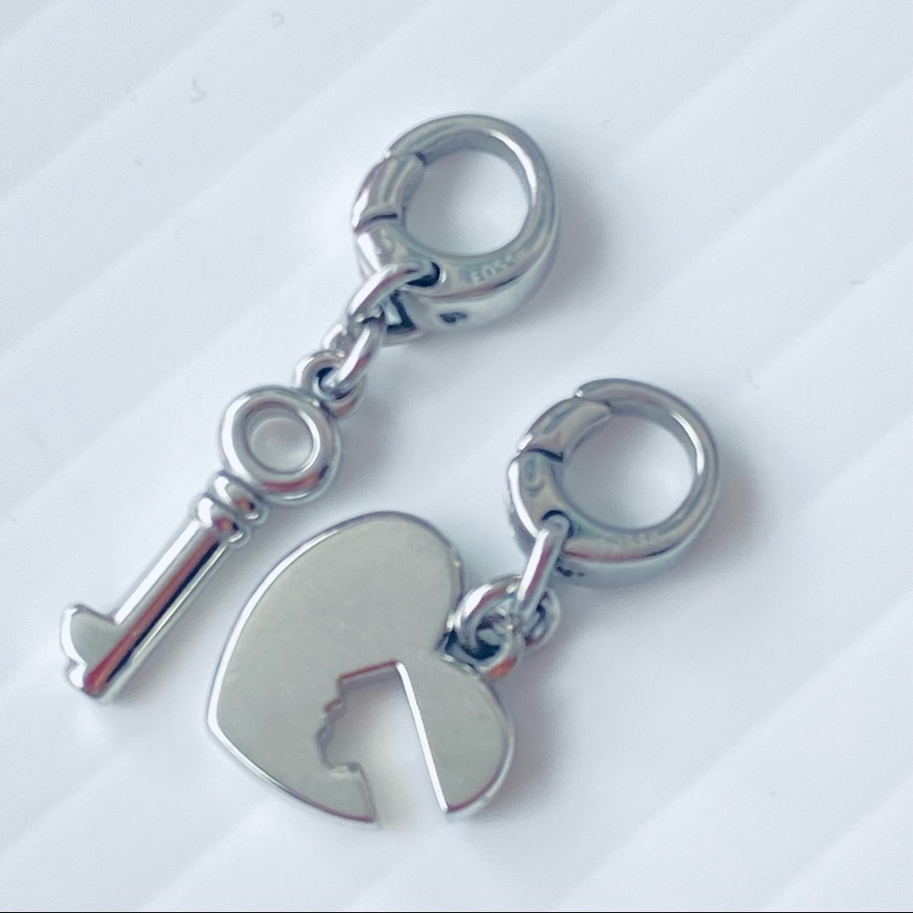 Fossil cut out heart and key pendant charms